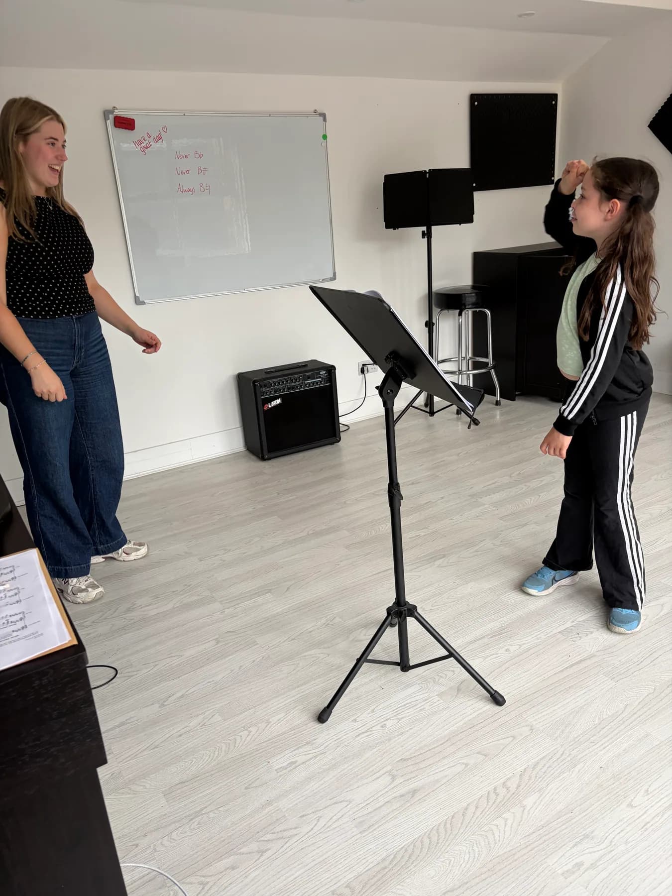 A vocal teacher coaching a student through a song